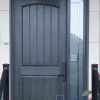 black fiberglass door with camber panel and sidelight