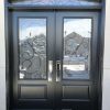 black steel door with transom