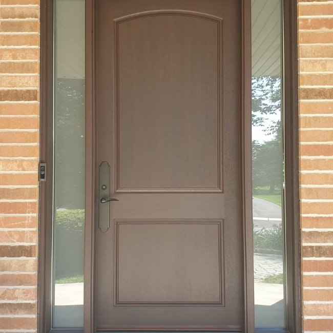 Brown fiberglass entry door with two sidelites.