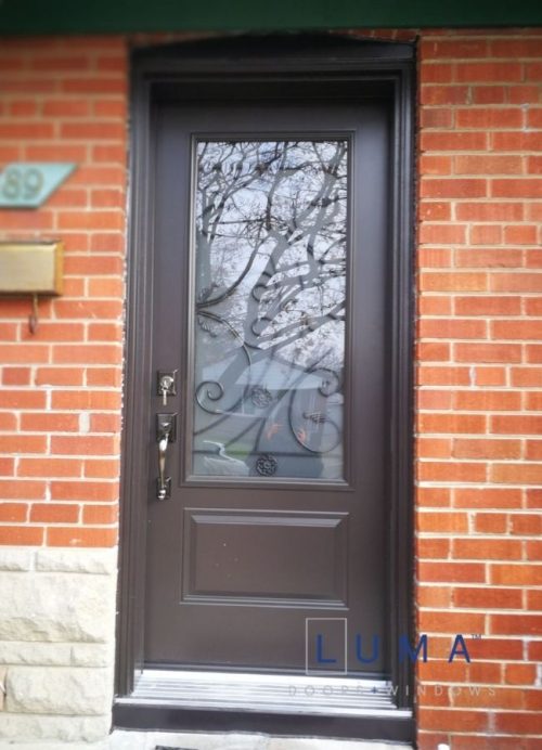 brown steel entry door with rod iron glass insert