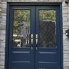 dark blue steel front door with decorative glass insert