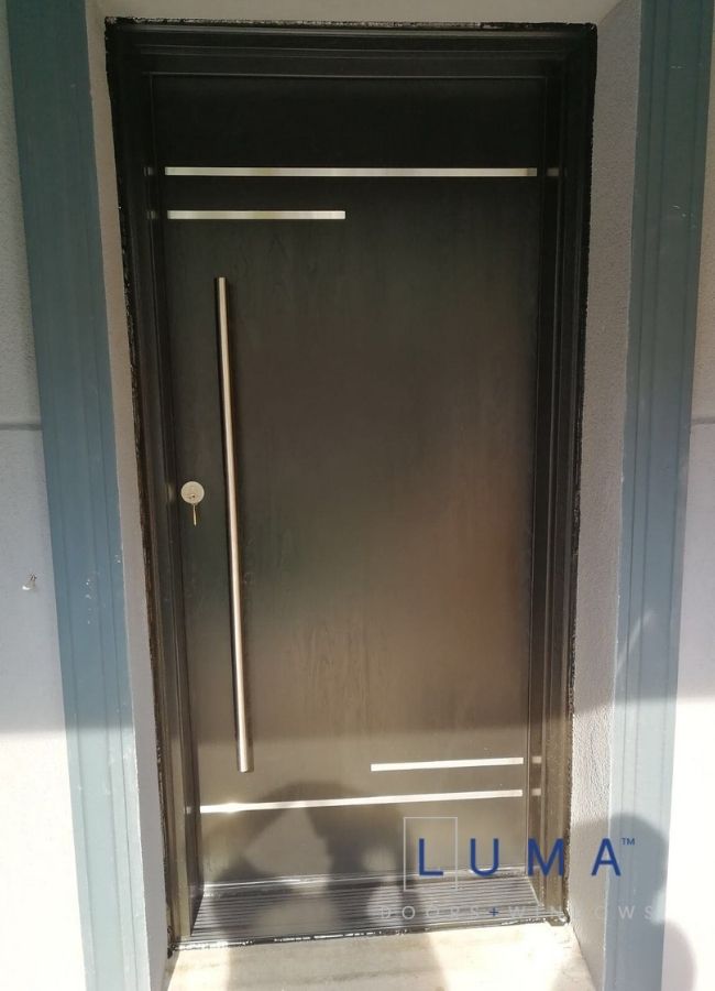 dark brown fiberglass front door with decoration