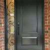 dark grey steel front door with one sidelite