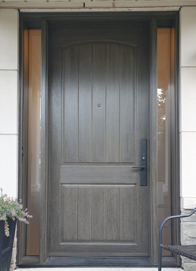 Grey fiberglass entry door with two sidelites.