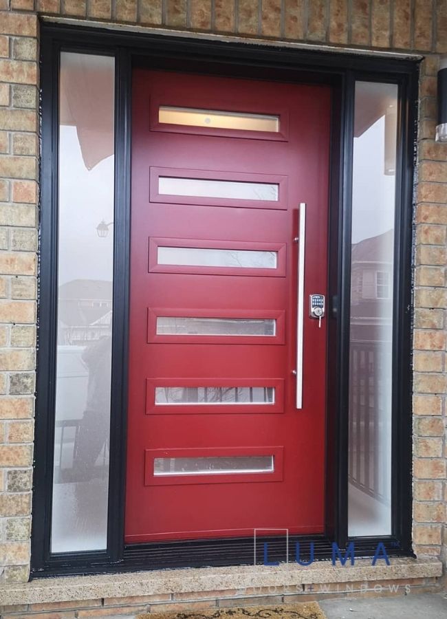 modern red steel entry door with two sidelites with black frame