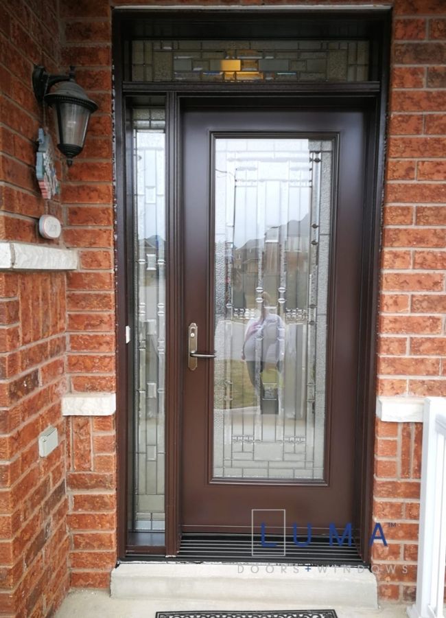 brown steel door with sidelite and transom