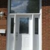 white steel front door with transom