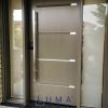 Modern Steel Door System. Single door with 2 sidelites, Novatech Vog Door slab with aluminum accents, direct Privacy glass sidelites, painted Gentek commercial brown exterior