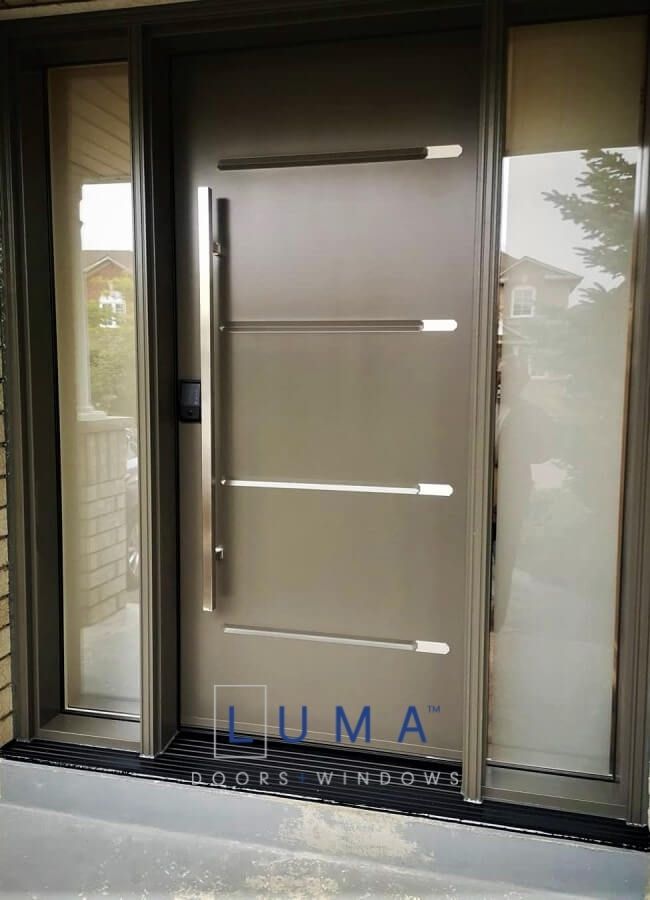 Modern Steel Door System. Single door with 2 sidelites, Novatech Vog Door slab with aluminum accents, direct Privacy glass sidelites, painted Gentek commercial brown exterior