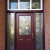 Steel Single door with 2 sidelites and transom, half size 22x36 cookstown glass design in door with matching direct set sidelite glass, painted burgundy colour exterior, operational vinyl sliding window in transom