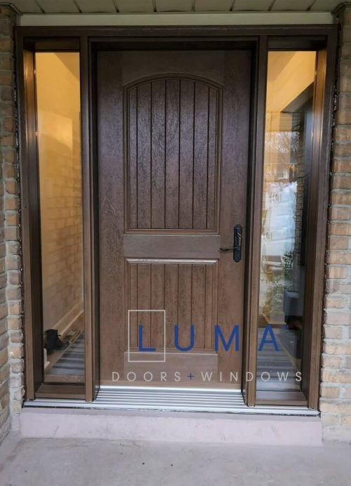 Fiberglass door system, Single door with 2 sidelites, mahogany grain 2 panel chamber top planks slab with clear glass direct sidelites, multi point locking system, stained light brown inside and out