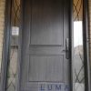 Fiberglass Door System. Single 42 inch mahogany 8 feel tall slab, direct glass sidelites, montage wrought iron glass design, black multi point lock system. Charcoal stain in and out