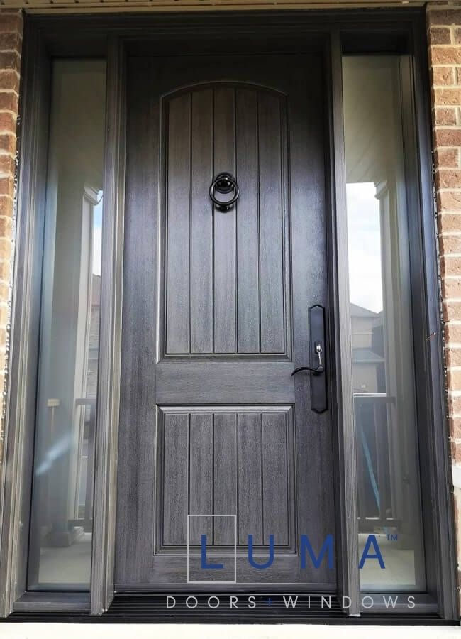 Fiberglass door system. Single 8 foot tall system, stained charcoal inside and out, privacy direct glass sidelites, black door knocker, black multi point lock system