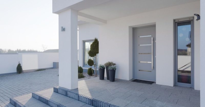 Home with grey steel entry door.