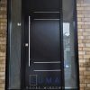 Modern Steel Door system, 8 foot tall system, 48 inch round silver pullbar, privacy glass sidelites, 4 line custom aluminum line design, painted black exterior