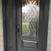 Steel Door system, Single door with panelled sidelite, 22x48 cookstown glass design with matching 764 sidelite glass, executive panel below glass, black threshold, painted iron ore exterior