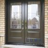 Steel Double Door system, 2 panel door slabs, Fusion 2248 Imola Glass design, black threshold, pewter colour door locks, painted commercial brown exterior