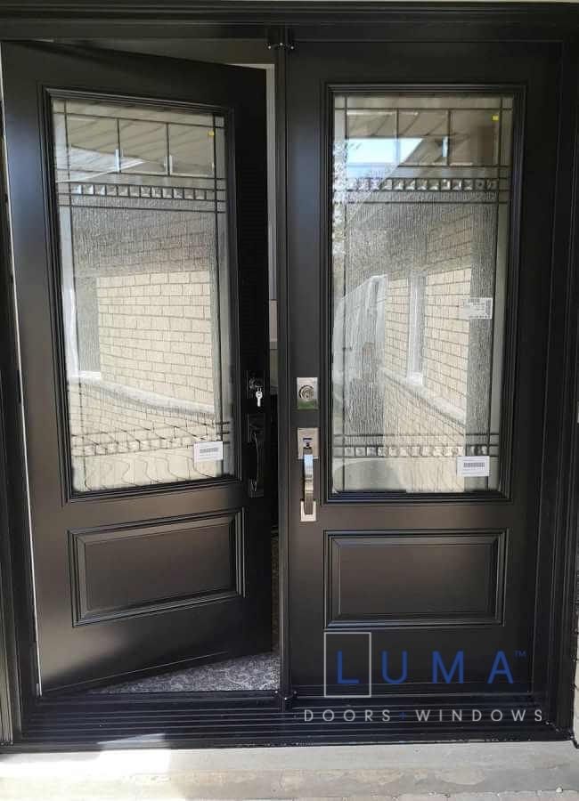 Steel Double door system, black exterior, 2 panel door slabs with 2248 Novatech Chanelle glass design
