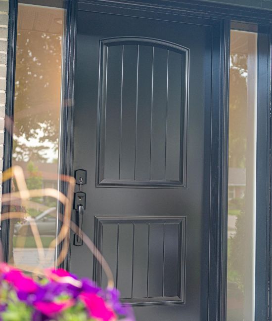beautifuk black door with twin sidelites