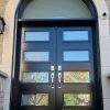 black double doors with transom and 8 glass inserts