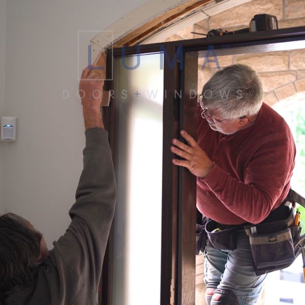 brown front door wiht transom and sidelites installation