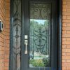traditional steel door with detailed glass