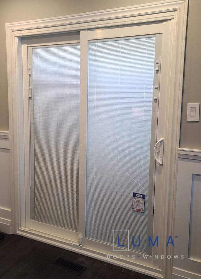 white sliding door with built in blinds