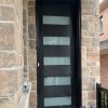 Black fiberglass entry door with multiple glass inserts